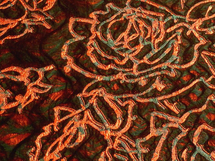 Coupon de tissu broché orange et vert