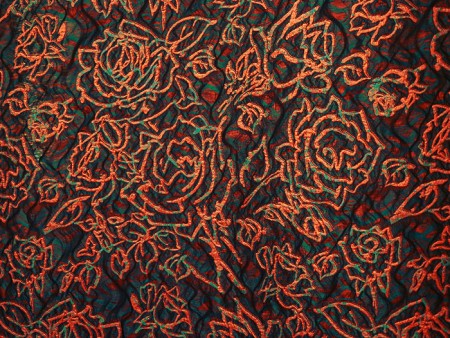 Coupon de tissu broché orange et vert