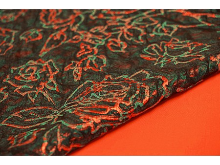 Coupon de tissu broché orange et vert