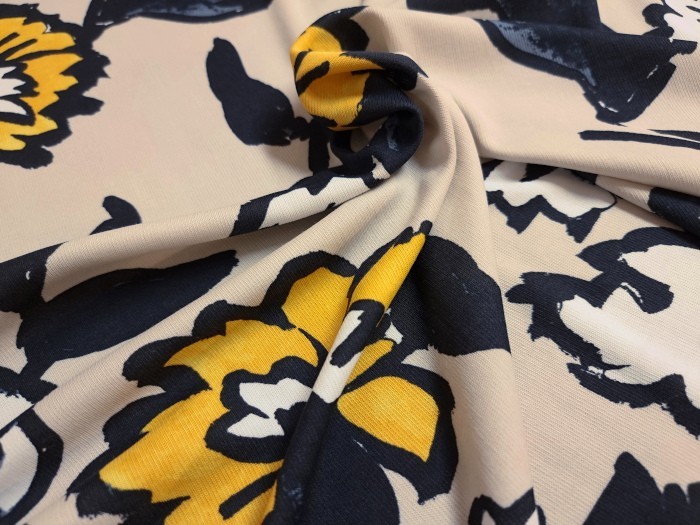 Tissu jersey imprimé fleurs bicolores