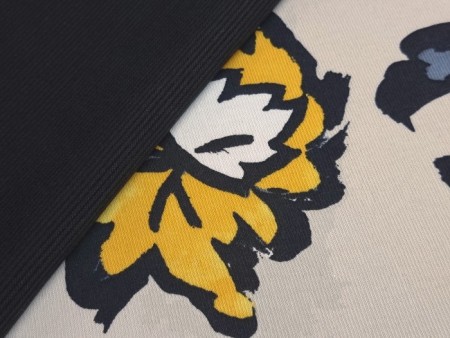 Tissu jersey imprimé fleurs bicolores